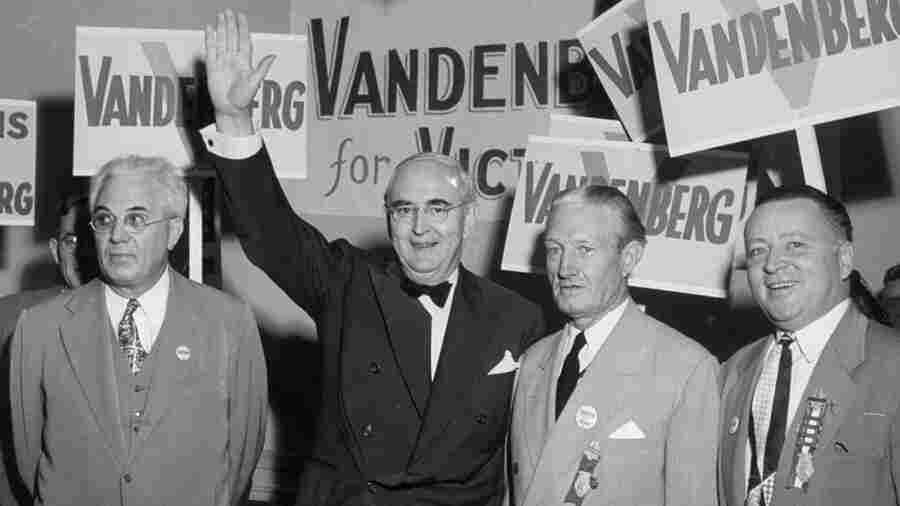 Michigan Sen. Arthur Vandenberg, with arm raised, greets the press at the 1948 Republican Convention. Vandenberg worked closely with President Harry Truman's Democratic administration on foreign policy issues even though he was seeking the Republican nomination to challenge the president. "Politics must stop at the water's edge," Vandenberg famously said.
