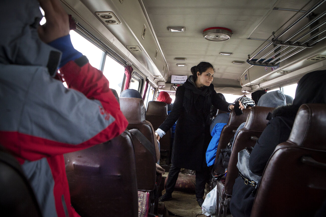 Nargis Azaryun briefs the young women in the bus heading to a weekly practice ascent on the outskirts of Kabul. Nargis Azaryun briefs the young women in the bus heading to a weekly practice ascent on the outskirts of Kabul.