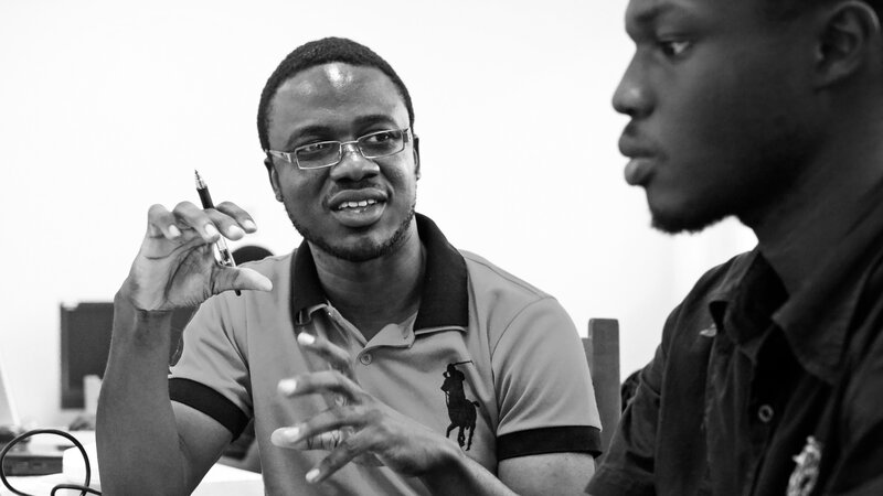 Kpetermeni Siakor (left), a Liberian who is studying in Ghana, used crowdsourcing software to help out during the Ebola epidemic.