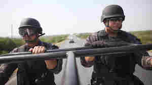 State police officers patrol a highway between Ciudad Victoria and Matamoros, in northeast Mexico, in 2011. Mexico's drug and turf wars have descended on the once tourist friendly border town of Matamoros.