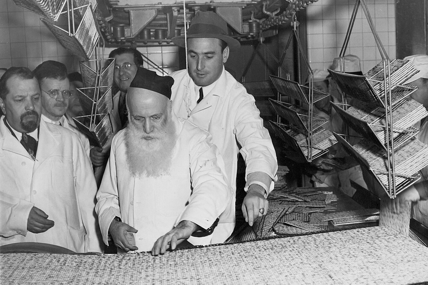 A rabbi (center) supervises the production of Passover matzos at the Streit's factory on New York's Lower East Side, circa 1960s. This Passover will be Streit's last one at the landmark location. A rabbi (center) supervises the production of Passover matzos at the Streit's factory on New York's Lower East Side, circa 1960s. This Passover will be Streit's last one at the landmark location.