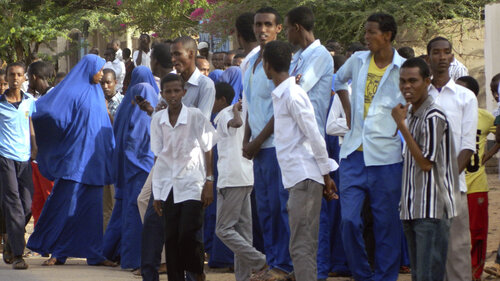 Students gather at a distance from the Garissa University College after an attack by gunmen in Garissa, Kenya, Thursday. The attack has injured dozens of people; a siege is ongoing.