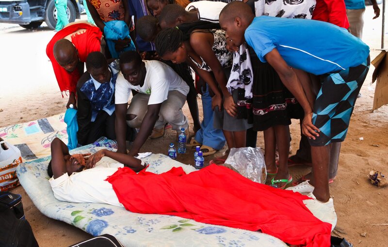 A survivor of the Garissa University attack talks to fellow students one day after gunmen attacked the university. The government says 147 people were killed.