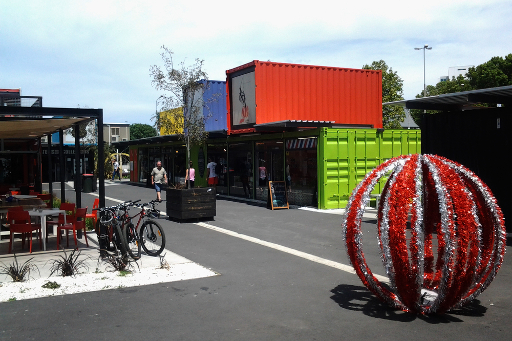 Pop-up stores and cafes in shipping containers cheer up the center of the earthquake-battered city.