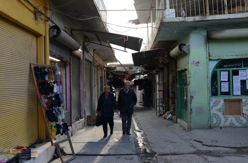 An Assyrian Christian couple walks through the market area of al-Qosh, where most residents have returned after fleeing last August in the face of an advance of the Islamic State. The ancient village is about 30 miles north of Mosul, Iraq's second biggest city, which is still held by the Islamic State.