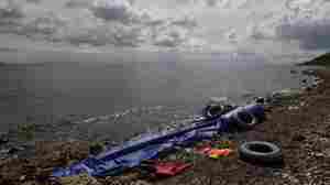 The remains of an inflatable boat that passed illegally from the coast of Turkey rest in October 2014 on the shore 10 miles from Mytilene, Greece. Thirty-four immigrants from Syria, among them one woman and three children, made a dangerous night journey Sept. 26.