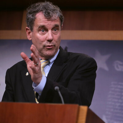 Sen. Sherrod Brown, seen here speaking about the trade bill Tuesday, told NPR "I bet that none of my colleagues have read the entire document. I would bet that most of them haven't even spent a couple hours looking at it." Brown acknowledged he has yet to read every single page of the trade agreement.