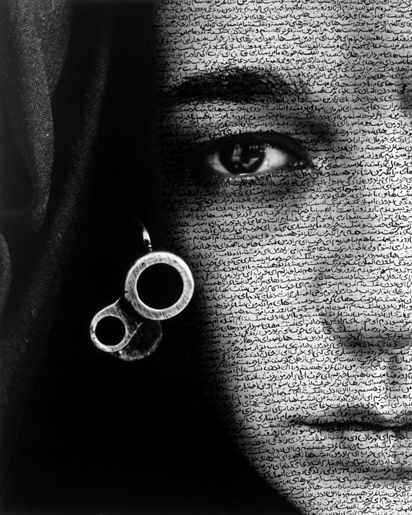 Calligraphy is often layered on the people in Neshat's photos. It falls over them like veils, or tattoos their skin. Curator Melissa Ho says text gives these silent faces a voice. Above, Neshat's 1996 work Speechless from the Women of Allah series. Calligraphy is often layered on the people in Neshat's photos. It falls over them like veils, or tattoos their skin. Curator Melissa Ho says text gives these silent faces a voice. Above, Neshat's 1996 work Speechless from the Women of Allah series.