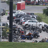 Police officers observe the scene at Twin Peaks restaurant in Waco, Texas, the site of the recent motorcycle gang-related shooting. Police officers observe the scene at Twin Peaks restaurant in Waco, Texas, the site of the recent motorcycle gang-related shooting.