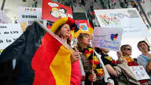 Striking French teachers hold a German flag as they take part in a nationwide protest against new measures aimed at revamping the country's school system, in Marseille, France, on May 19. France's 840,000 teachers are largely opposed to the reform, their unions say, fearing it will increase competition between schools and exacerbate inequalities.