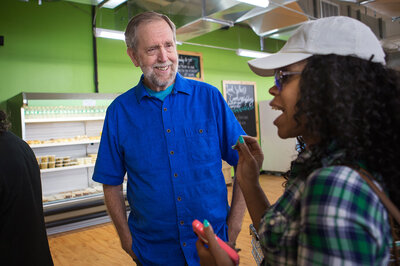 Daily Table founder Doug Rauch greets Latoya Rush after she walks into the store. Daily Table founder Doug Rauch greets Latoya Rush after she walks into the store.