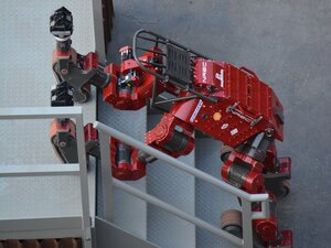 Carnegie Mellon's CHIMP uses its tracks to hoist itself up the stairs, completing the final task of the course. Carnegie Mellon's CHIMP uses its tracks to hoist itself up the stairs, completing the final task of the course.