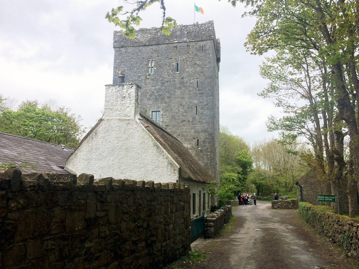 A school group gathers outside Thoor Ballylee, a 15th-century stone tower where Yeats lived for many years.