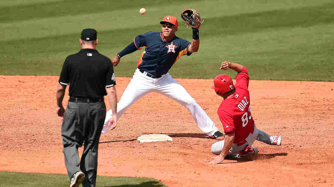 Did the St. Louis Cardinals try to steal more than second base from the Houston Astros? The FBI is looking into a hacking attack on a key Astros database. Here, the Cardinals' Aledmys Diaz is tagged out at second by Carlos Correa of the Astros during a spring training game in March.