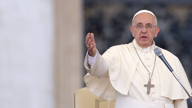 Pope Francis speaks to crowds gathered Sunday in St. Peter's Square at the Vatican.