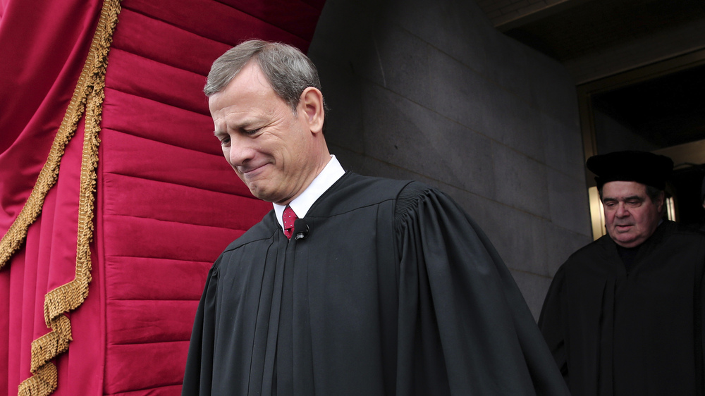U.S. Supreme Court Chief Justice John Roberts, followed by Justice Antonin Scalia, at the U.S. Capitol in Washington, D.C., in 2013