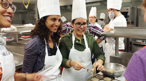 Dr. Geeta Maker-Clark (center) talks to medical students during a culinary medicine class she co-taught with Dr. Sonia Oyola (left) this spring in Chicago. On the right, student Maggie Montoya.