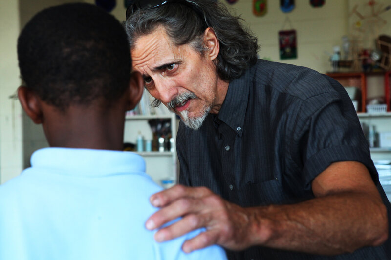 Schergen talks with one of his sixth-grade students. Schergen talks with one of his sixth-grade students.