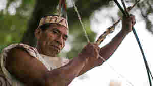 Victorio Dariquebe Gerewa displays his bow and arrow at the Smithsonian Folklife Festival in Washington, D.C.