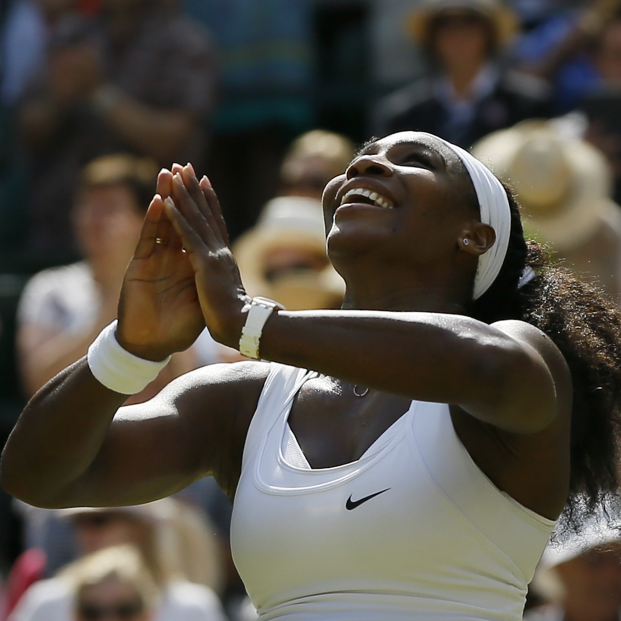Serena Williams wins the singles match against Garbine Muguruza of Spain after the women's singles final at the All England Lawn Tennis Championships in Wimbledon, London, on Saturday. Williams won 6-4, 6-4.