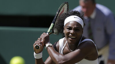 Serena Williams returns a shot to Garbine Muguruza of Spain during the women's singles final at the All England Lawn Tennis Championships in Wimbledon, London, on Saturday.