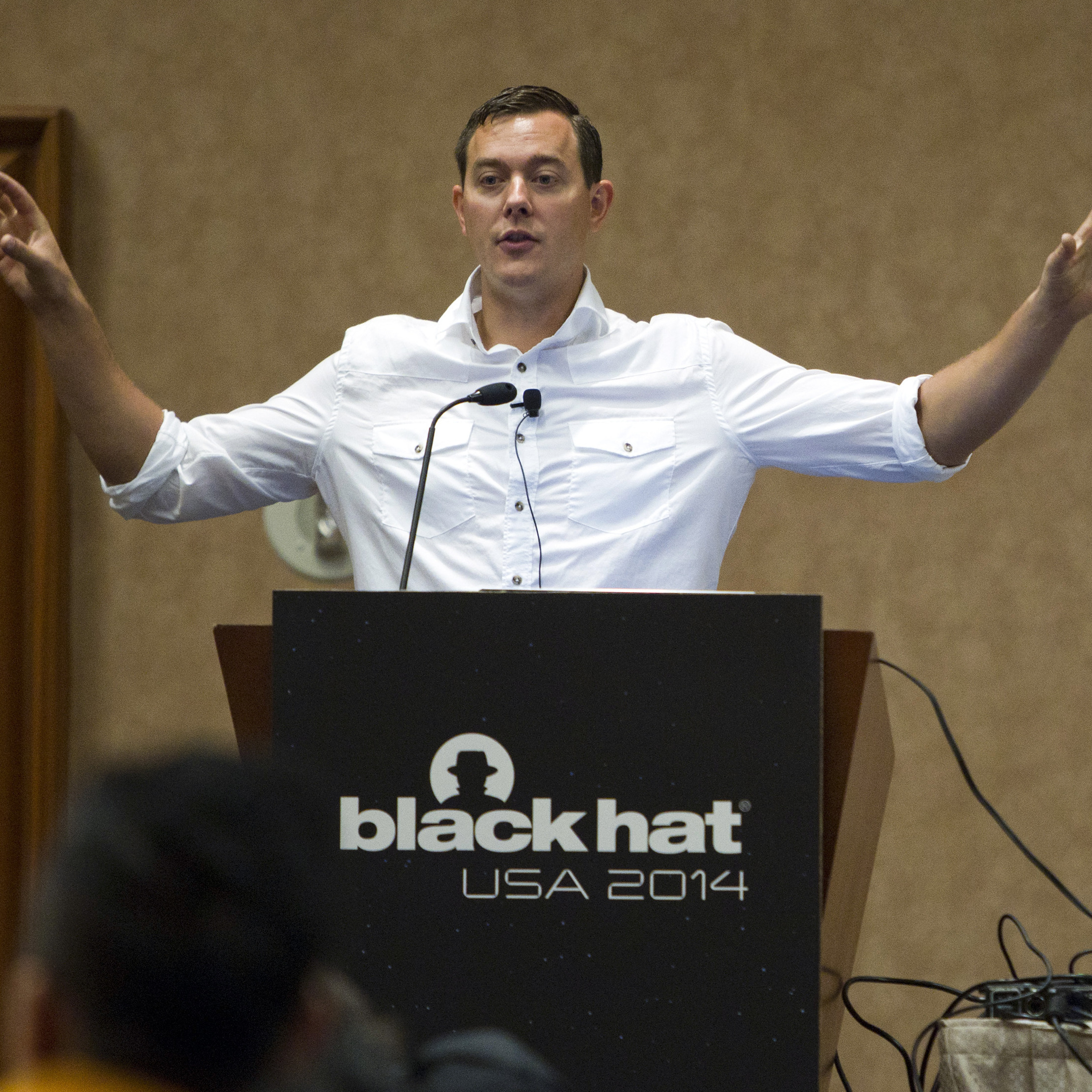 Chris Valasek (left) and Charlie Miller talk about hacking into vehicle computer systems during the Black Hat USA 2014 hacker conference in Las Vegas last August.