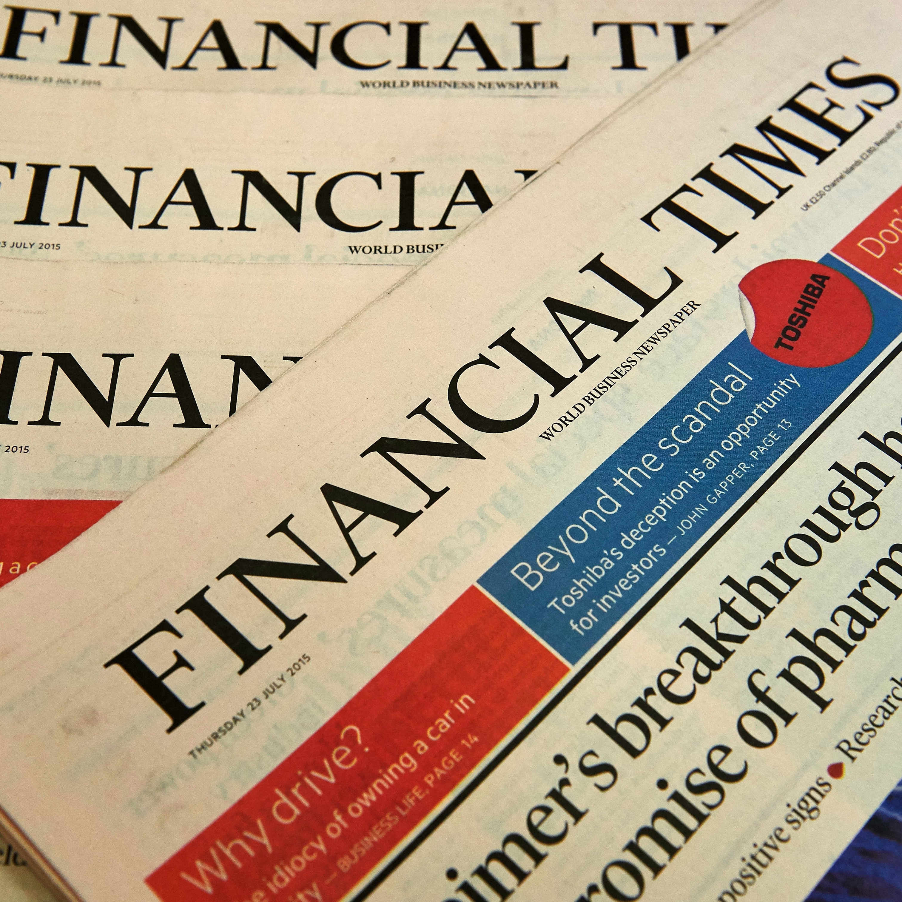 Copies of the Financial Times newspaper are displayed for a photograph in London. British publisher Pearson is selling the paper to Japanese media company Nikkei.