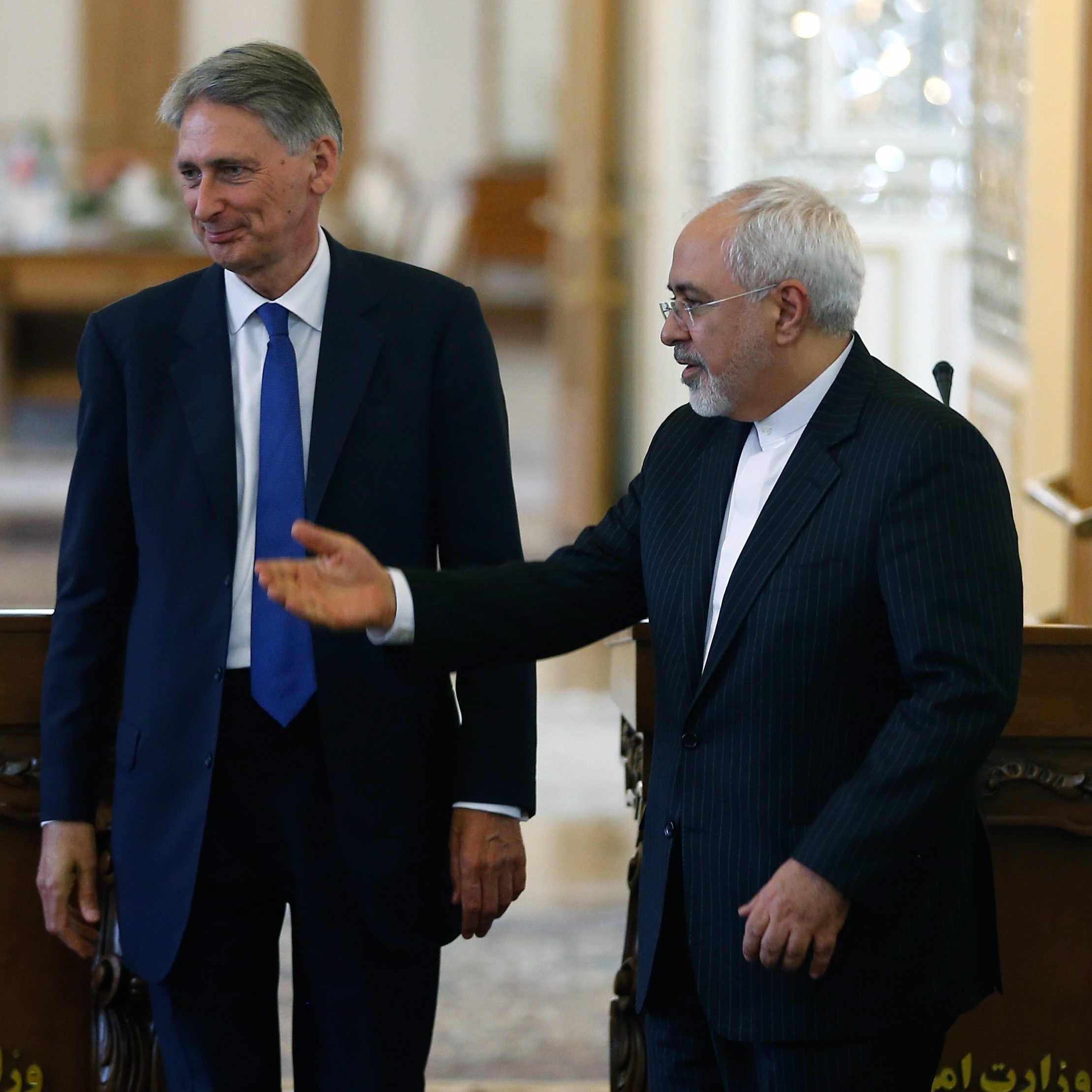 British Foreign Secretary Philip Hammond and Iranian Foreign Minister Mohammad Javad Zarif deliver a joint news conference following their meeting in Tehran, on Sunday, as the British embassy is reopened after being shuttered for nearly four years.