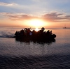 Syrian migrants in an overcrowded dinghy from Turkey arrive on the Greek island of Kos on Aug. 29. Syrian migrants in an overcrowded dinghy from Turkey arrive on the Greek island of Kos on Aug. 29.
