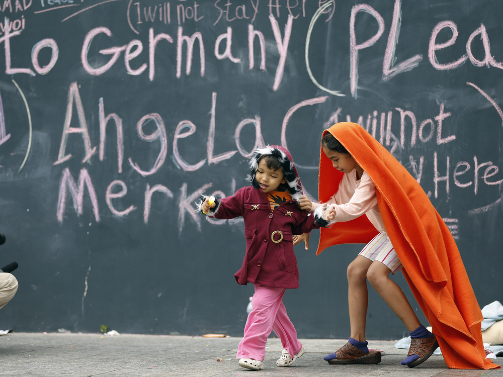 Migrant children play at Keleti railway station in Budapest, Hungary, on Friday. Many of their families hope to reach Germany and gain political asylum.