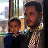A man and a child stand in the doorway of a bus provided by Hungarian authorities for migrants and refugees stranded at the Keleti train station in Budapest, Hungary, on Saturday. The migrants boarded buses provided by Hungary's government and headed to Austria, which allowed them in. A man and a child stand in the doorway of a bus provided by Hungarian authorities for migrants and refugees stranded at the Keleti train station in Budapest, Hungary, on Saturday. The migrants boarded buses provided by Hungary's government and headed to Austria, which allowed them in.