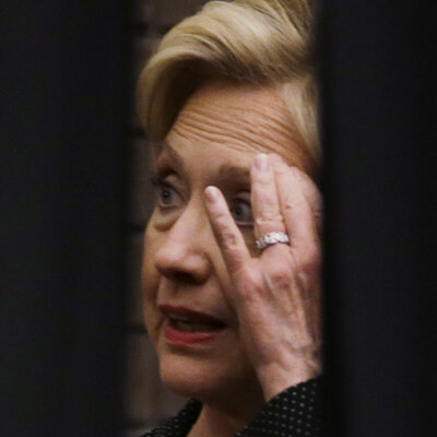 Hillary Clinton waits behind a curtain before a rally at the University of Wisconsin, Milwaukee on Thursday. She continues to struggle to explain her use of a private email server while secretary of state.