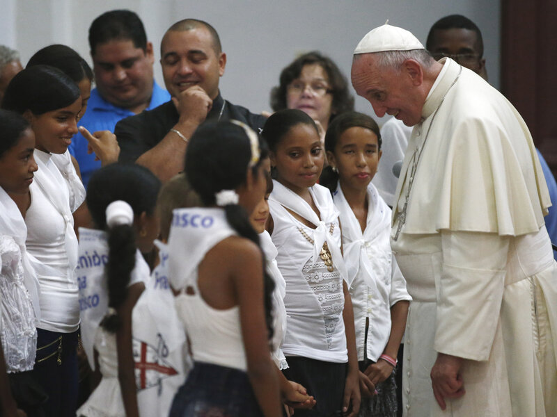 Pope Francis talks with a group of children in the sanctuary of the Virgin of Charity of Cobre, in El Cobre, Cuba, Monday, Sept. 21, 2015. (Tony Gentile/AP)