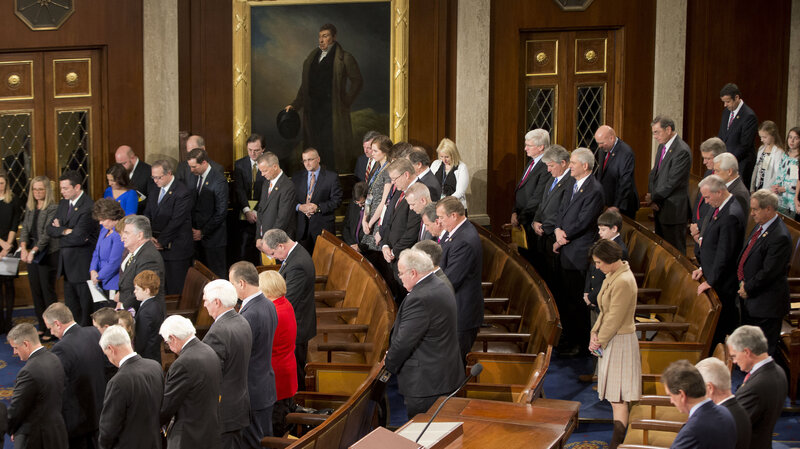 Members of the House of Representatives bow their heads for a prayer as they gather for opening session of the 114th Congress in January. (Pablo Martinez Monsivais/AP)