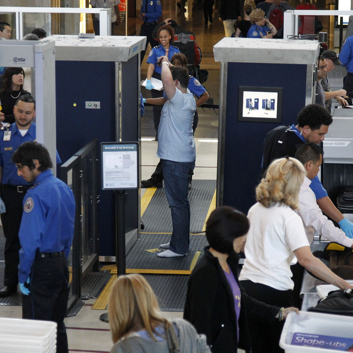 A man is screened with a backscatter X-ray machine as travelers go through a security checkpoint at Los Angeles International Airport in 2011.
