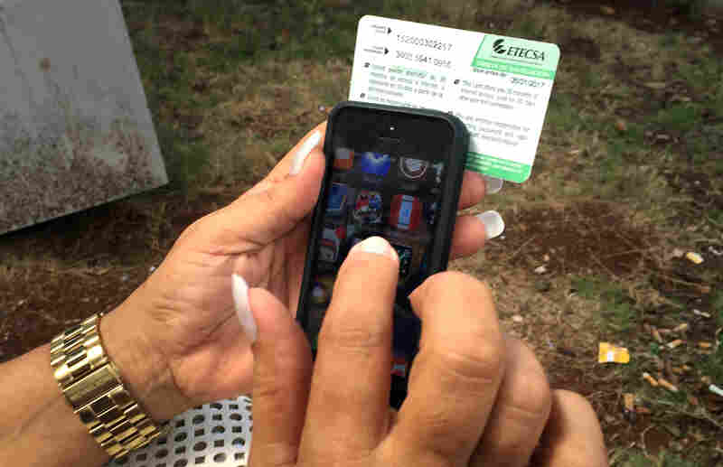 Mari Jimenez, 53, uses an Internet access card sold by the state phone company. Mari Jimenez, 53, uses an Internet access card sold by the state phone company.