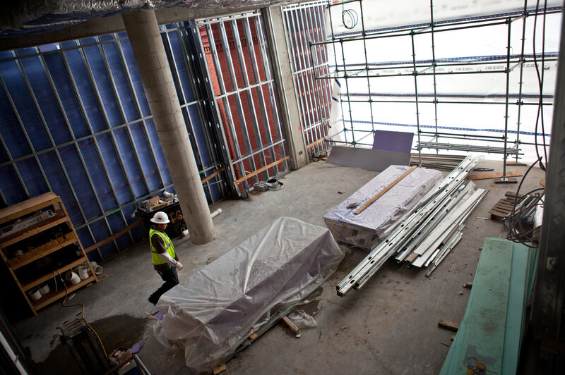 A view of construction underway, showing what will eventually be open community space at the John and Jil Ker Conway Residence. (Jun Tsuboike/NPR) A view of construction underway, showing what will eventually be open community space at the John and Jil Ker Conway Residence.