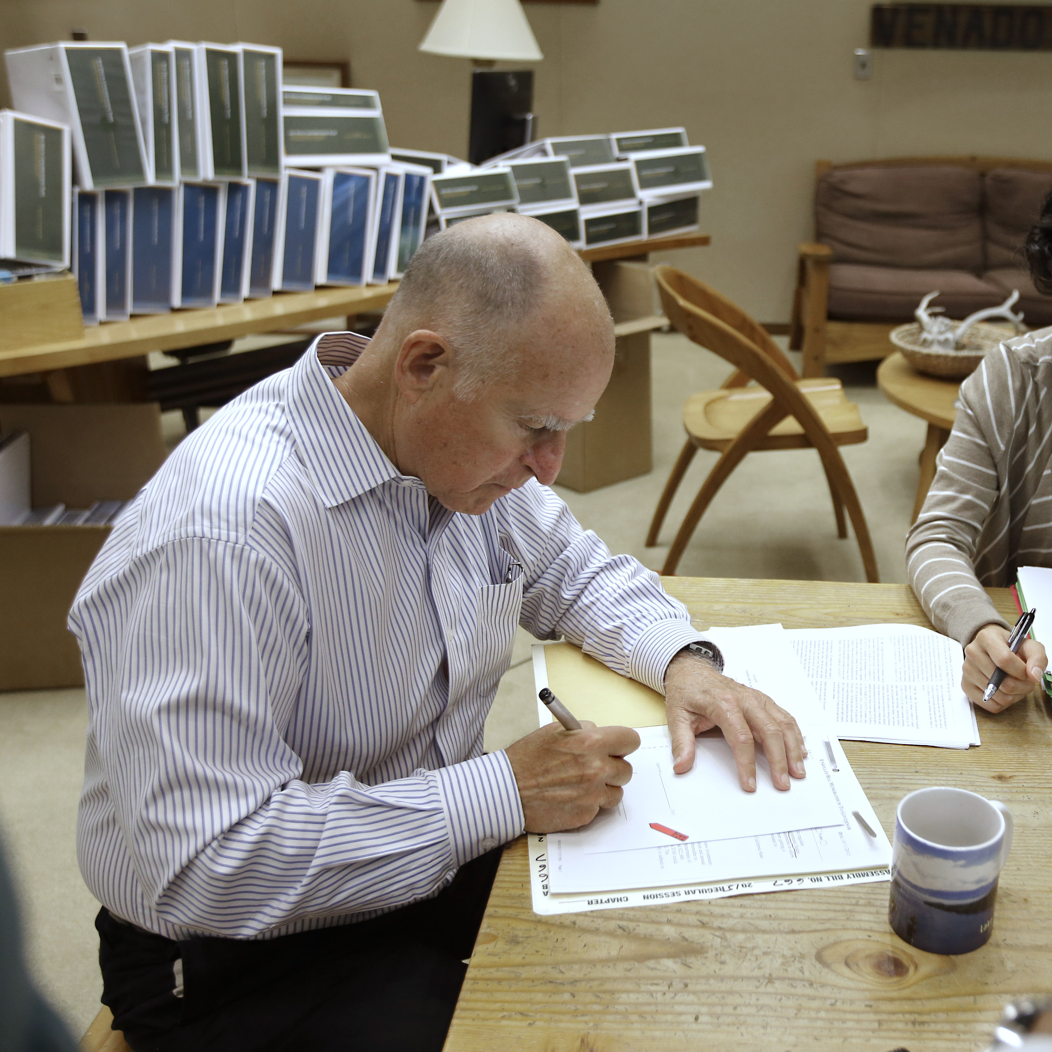 California Gov. Jerry Brown signs one of the hundreds of bills on Friday, among them a new law that is contains the most stringent digital privacy protections in the country.