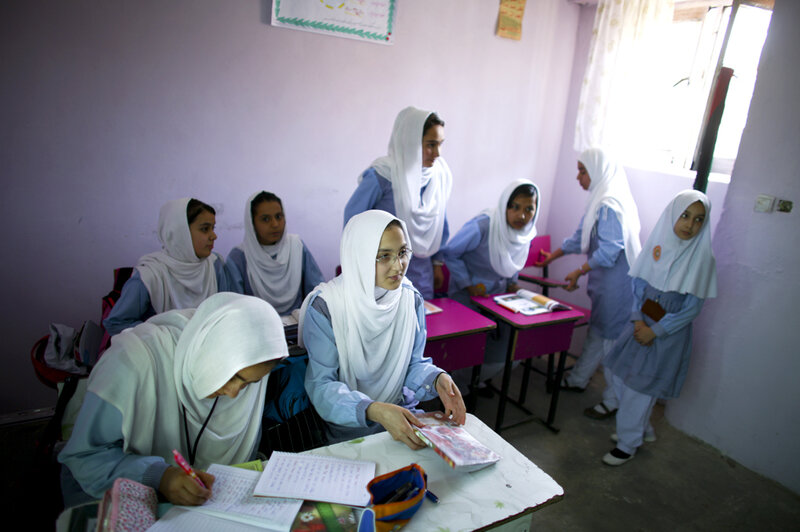 These girls are the lucky ones — they've been able to stay in school while many of their peers have dropped out. (David Gilkey/NPR)