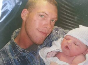 Billy Doyle Walker with his daughter Kaylee on the day she was born. Four months later he died after falling from a tower he was painting. The opt-out plan his employer uses provided his family with only a quarter of the benefits they may have received under the state's workers' compensation law. (Courtesy of Krystle Meloy) Billy Doyle Walker with his daughter Kaylee on the day she was born. Four months later he died after falling from a tower he was painting. The opt-out plan his employer uses provided his family with only a quarter of the benefits they may have received under the state's workers' compensation law.