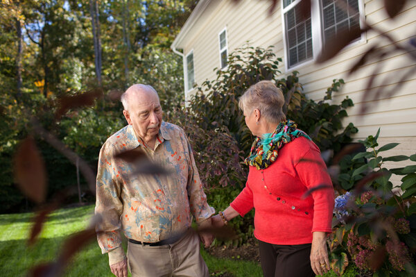 Alan Hoffman, shown with his wife Nancy at their home in Dumfries, Va., found that his Parkinson's symptom improved when he took a cancer drug. (Claire Harbage for NPR)