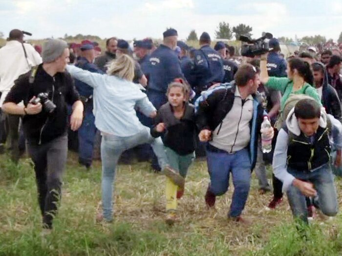 This video grab made on early September shows a Hungarian TV camerawoman kicking a child as she runs with other migrants from a police line during disturbances at Röszke, southern Hungary. (AFP/Getty Images) This video grab made on early September shows a Hungarian TV camerawoman kicking a child as she runs with other migrants from a police line during disturbances at Röszke, southern Hungary.