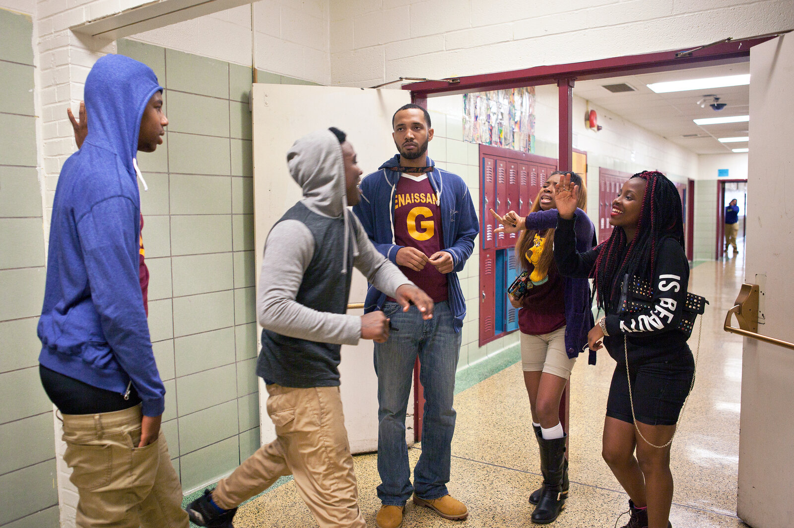 Taylor watches students following an incident during class. Mentors often help teachers intervene. Taylor watches students following an incident during class. Mentors often help teachers intervene.
