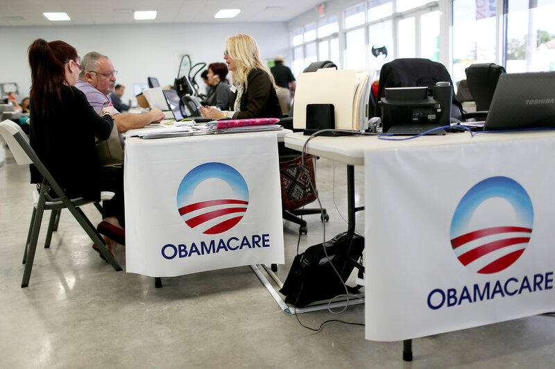 From left, Aymara Marchante and Wiktor Garcia talked with Maria Elena Santa Coloma, an insurance adviser with UniVista Insurance, during February 2015 sign-ups for health plans in Miami, Fla. (Joe Raedle/Getty Images)