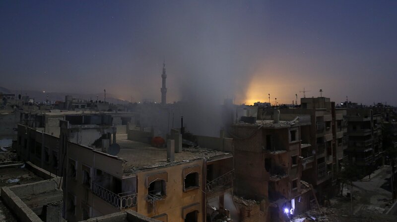 The U.S. plans to send up to 50 members of its Special Operations Forces to Syria to help fight ISIS. They'll be entering a war zone with many combatants. Here, smoke rises from a building in the rebel-controlled area of Douma, east of Damascus, early Friday, after a reported shelling by Syria's government.