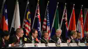 Trade representatives attend a press conference for the Trans-Pacific Partnership.