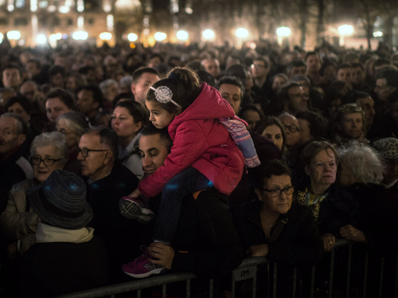 People gather outside of Notre Dame Cathedral in Paris, ahead of a ceremony for the victims of Friday's terrorist attacks. (David Ramos/Getty Images)