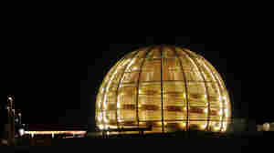 The globe of the European Organization for Nuclear Research, CERN, outside Geneva, Switzerland, is illuminated in this 2010 photo.