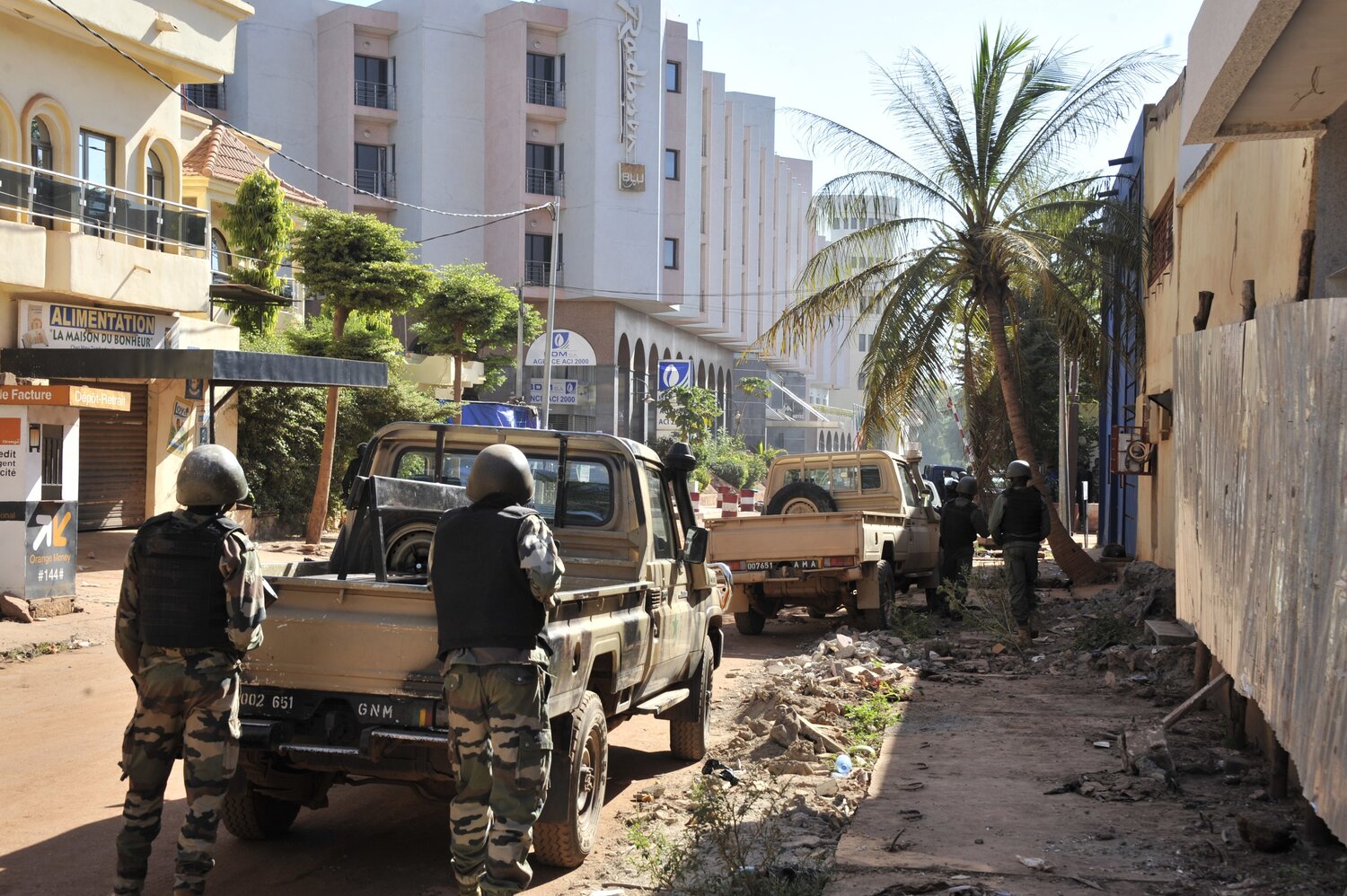 Malian troops take position outside the Radisson Blu hotel in Bamako on Friday. Gunmen went on a shooting rampage at the hotel in the capital of Bamako, seizing 170 guests and staff. (Habibou Kouyate/AFP/Getty Images)