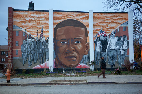 A mural for Freddie Gray is seen at the intersection of North Mount and Presbury streets where he was arrested in April. (Jun Tsuboike/NPR)